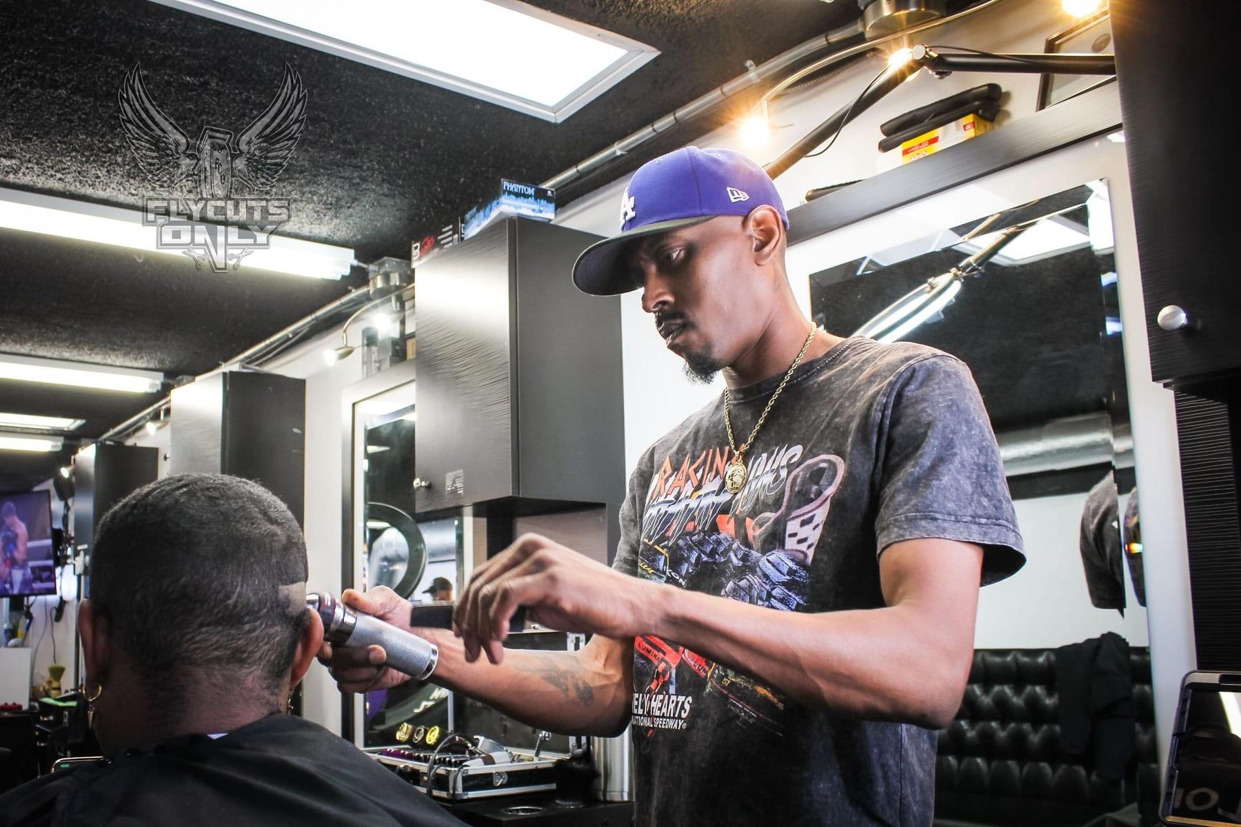 Fly lining a client up at the chair with a trimmer
