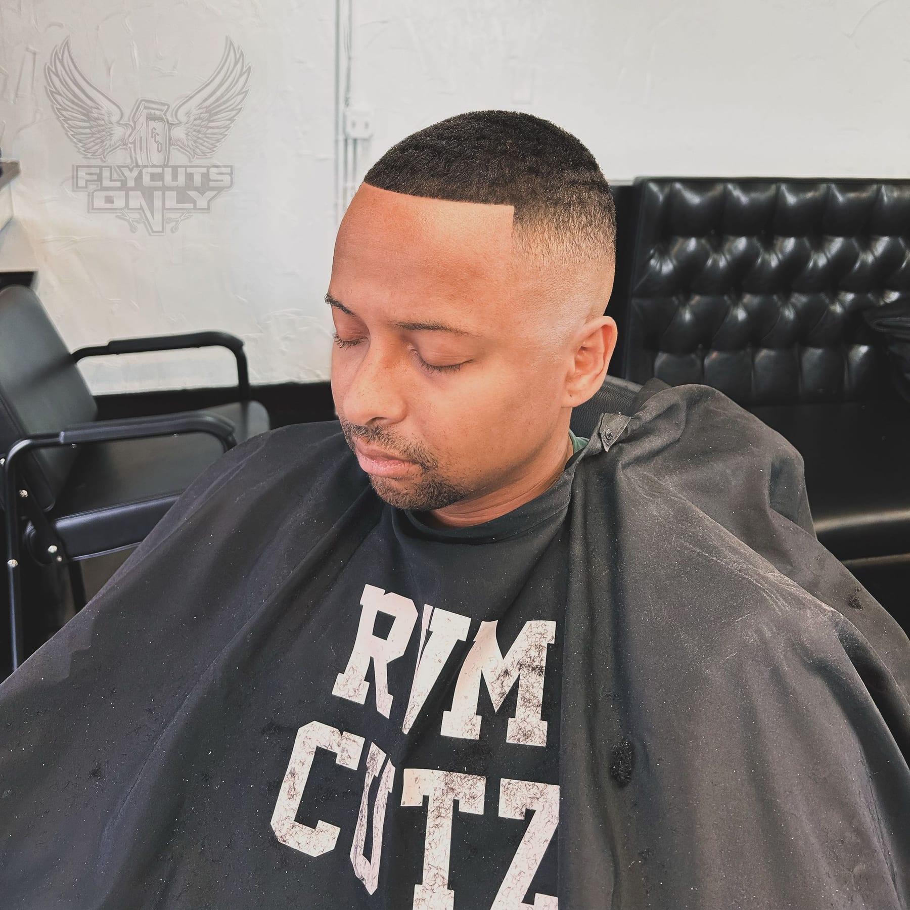 Bald fade finished with a straight razored hairline