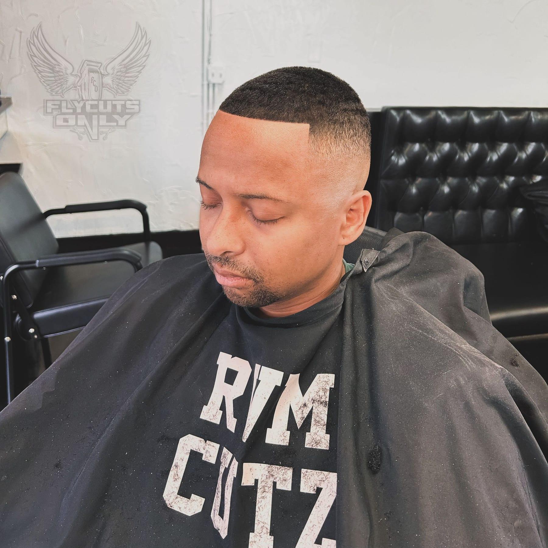 Waves under a fitted cap after a temple taper